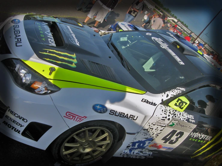 two race cars with yellow and black painted stripes