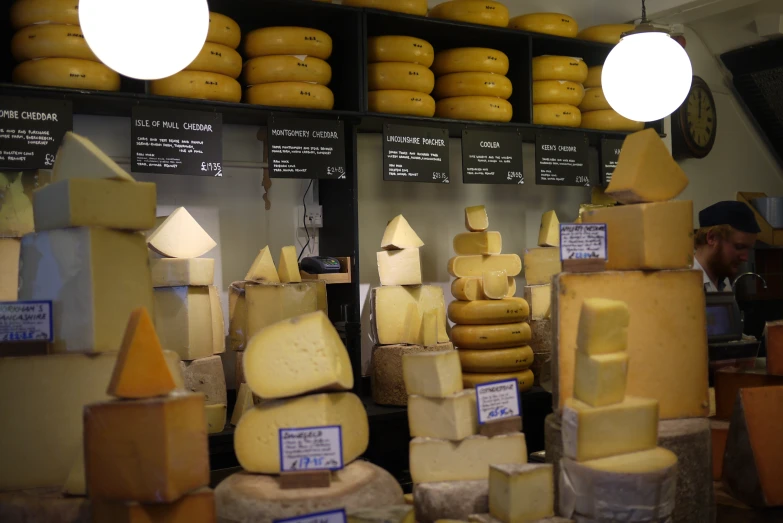 cheese on display at an asian market, cheese is made and sold in the store