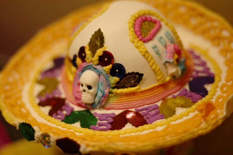 a white doll with a colorful hat and hair