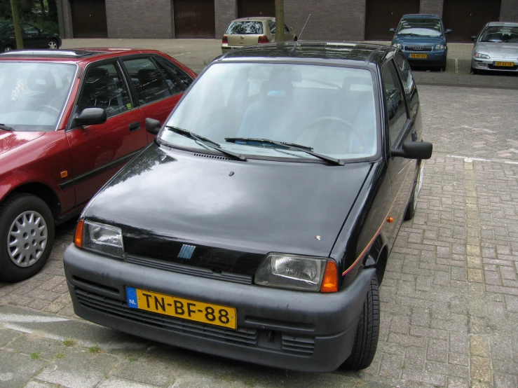 two cars are parked next to each other