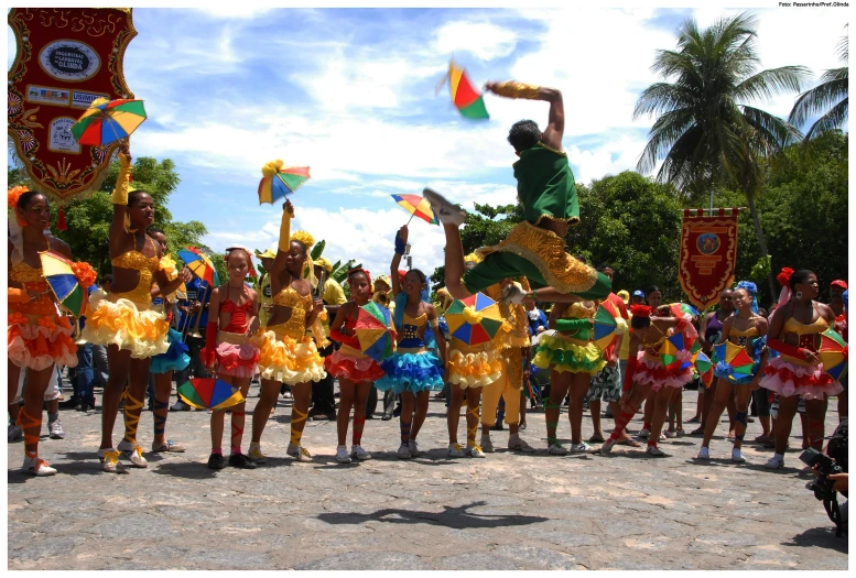 a group of people in costume standing in front of a crowd