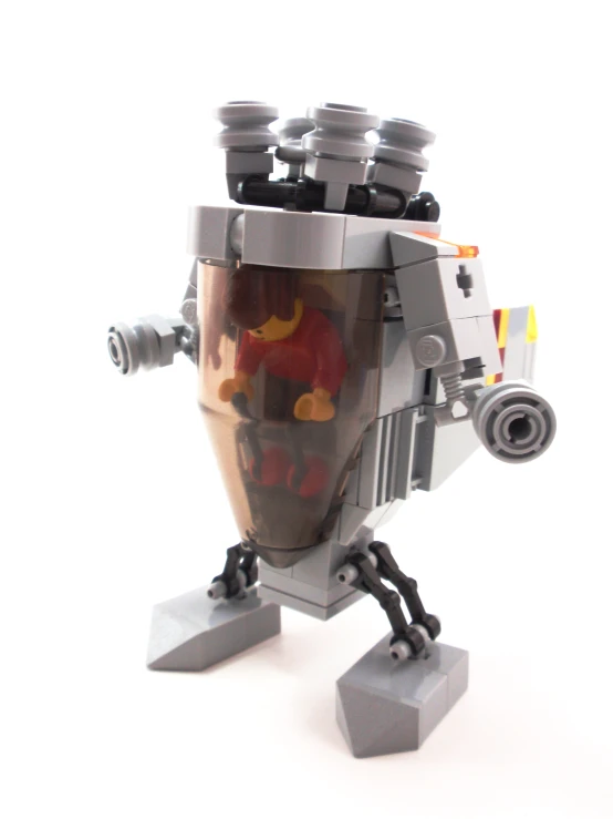 there is a lego robot that has a cup of liquid inside