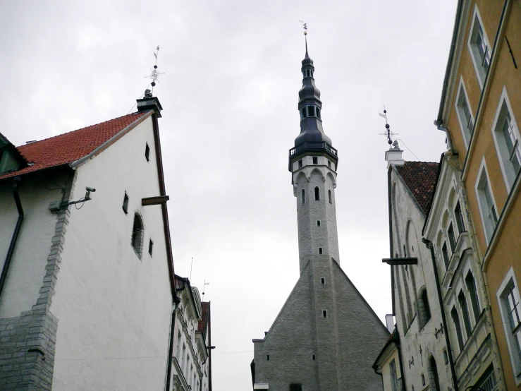 a clock tower and steeple on a city street