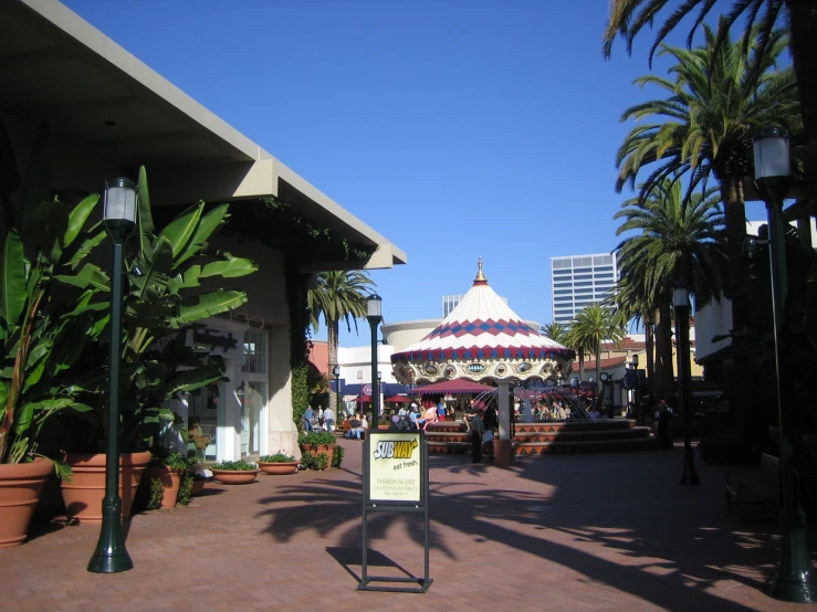 a large fairground with a big red and white carousel