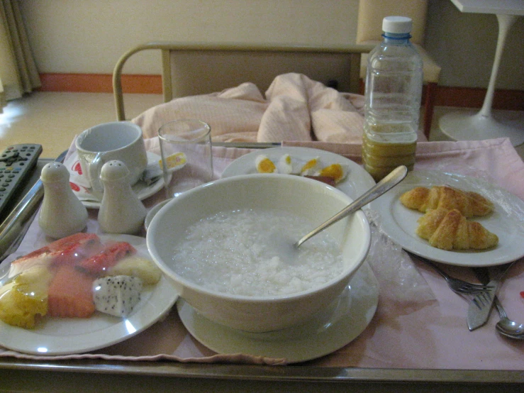 a table with a bowl of food and drinks on it