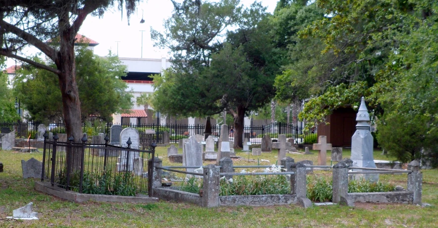 a cemetery with a gate around the cemetery
