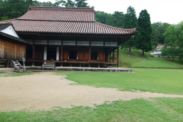 a barn and a field is on display