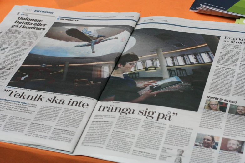 a news piece featuring an airplane on the newspaper