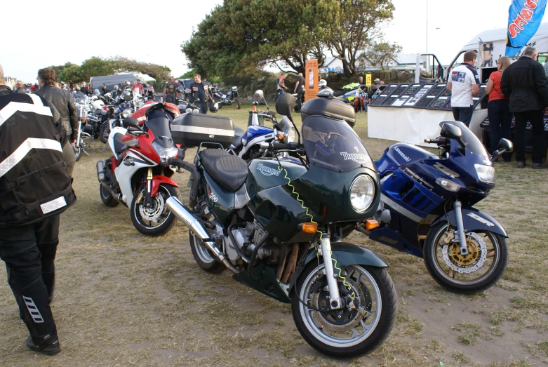 a group of motorcycles parked in a line