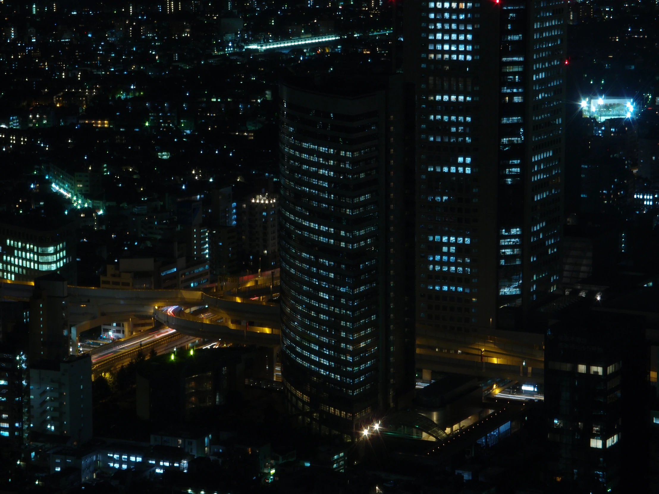some buildings are shown at night in the city