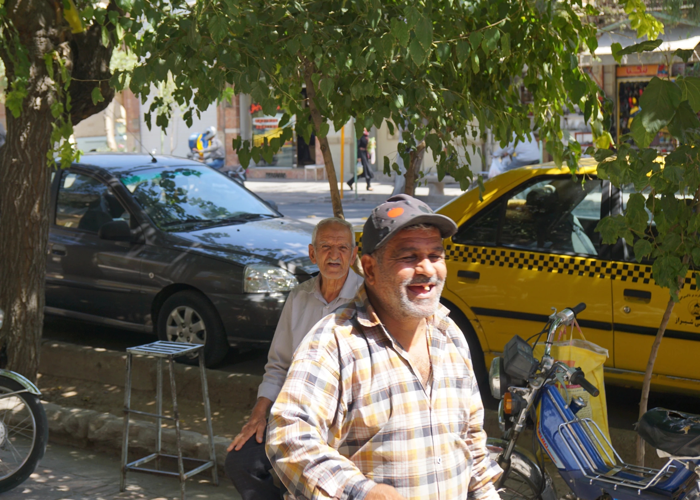 an old man and a young woman riding their bikes