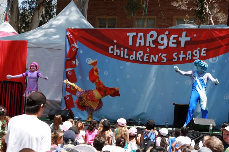children's stage performance in front of a tent
