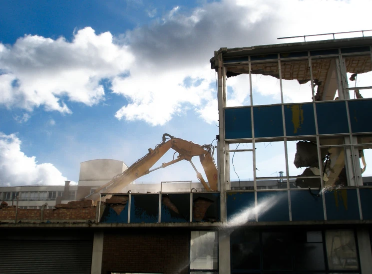 a machine on top of the roof being worked on by a person