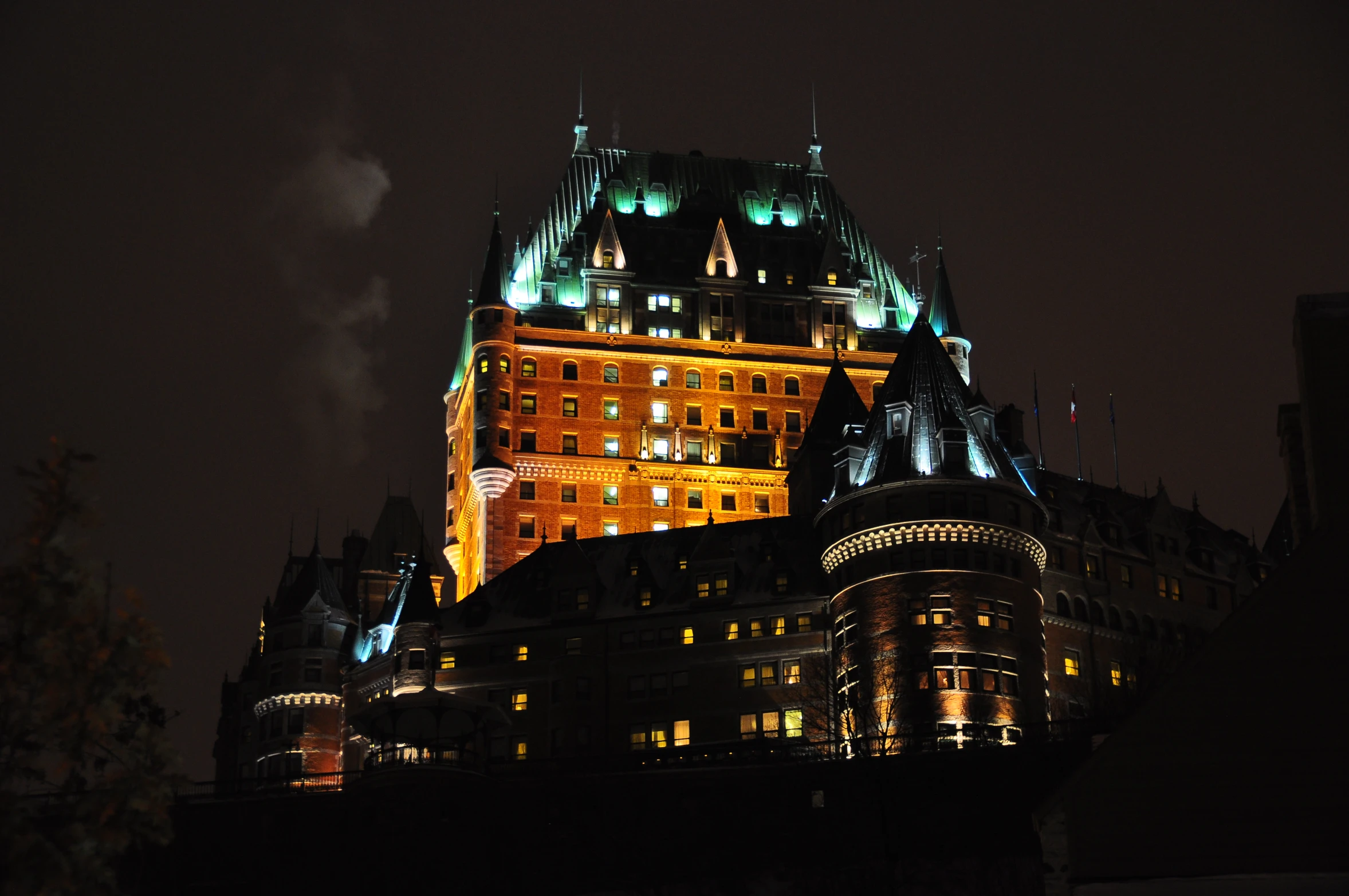 an old building at night with many lights