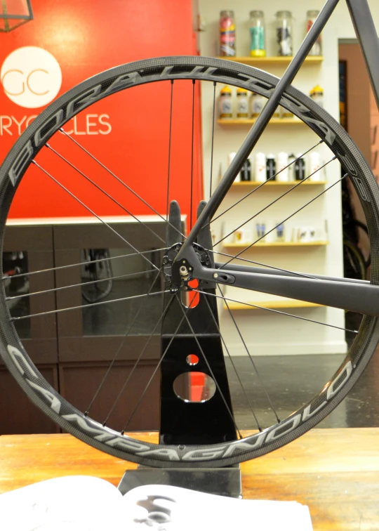 a wheel is shown in a bike shop