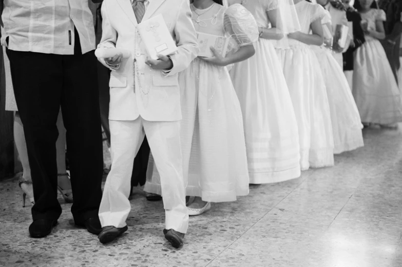 a black and white po of children at a ball