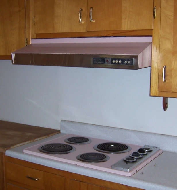 a stove is shown in a kitchen with cabinets