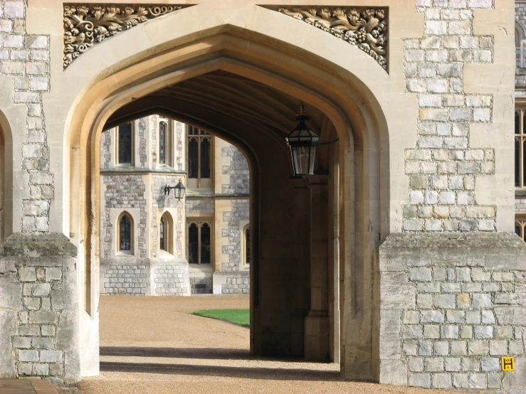 a tall gated building with an entrance