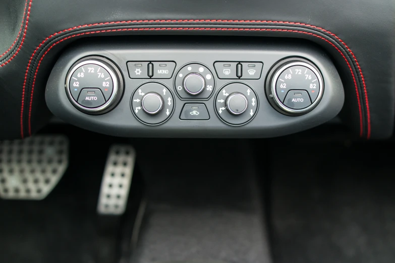 a car interior dashboard with controls and ons