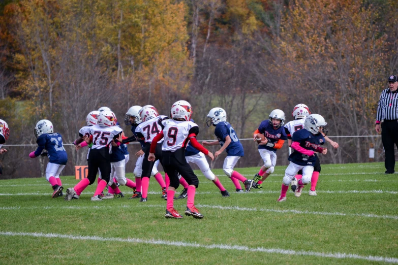 the football team is preparing to kick the ball