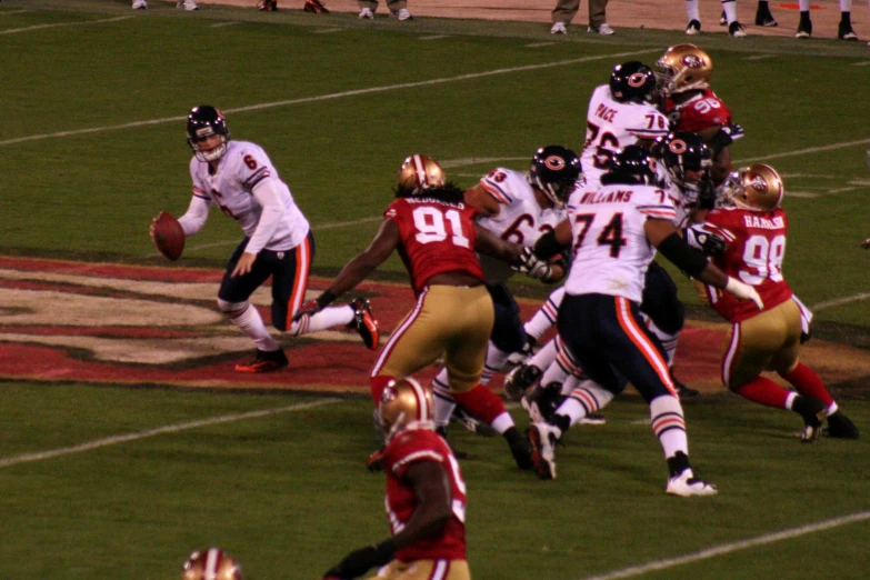 a football player prepares to get the ball from another player