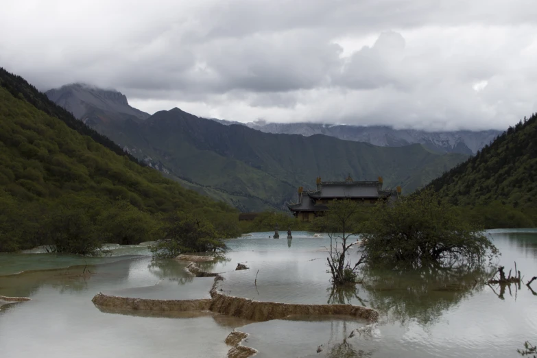 flood waters surround a lake in the mountains