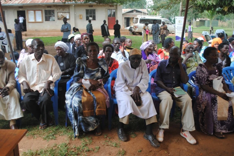 a large group of people sitting in lawn chairs