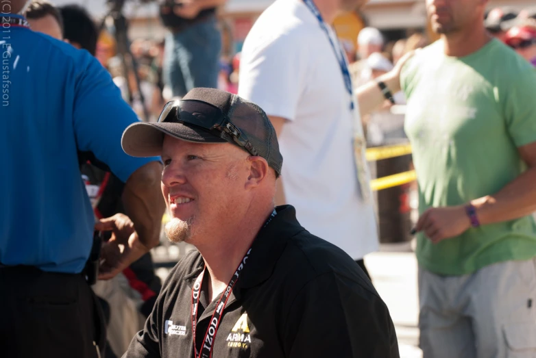 a man wearing a hat and looking off into the distance