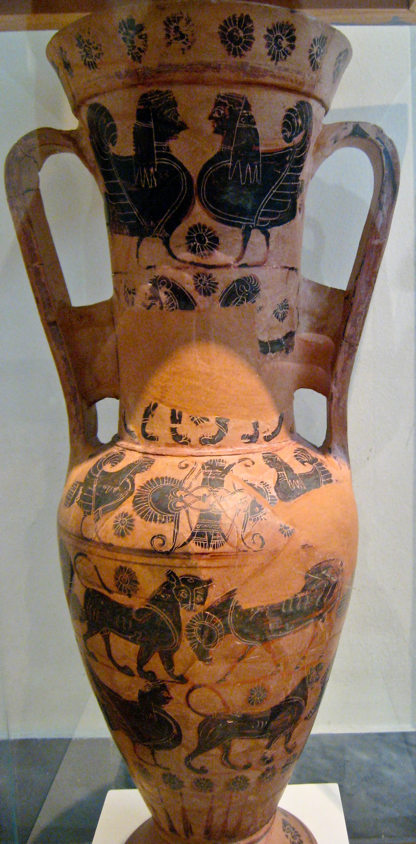 an old urn sitting in a display case