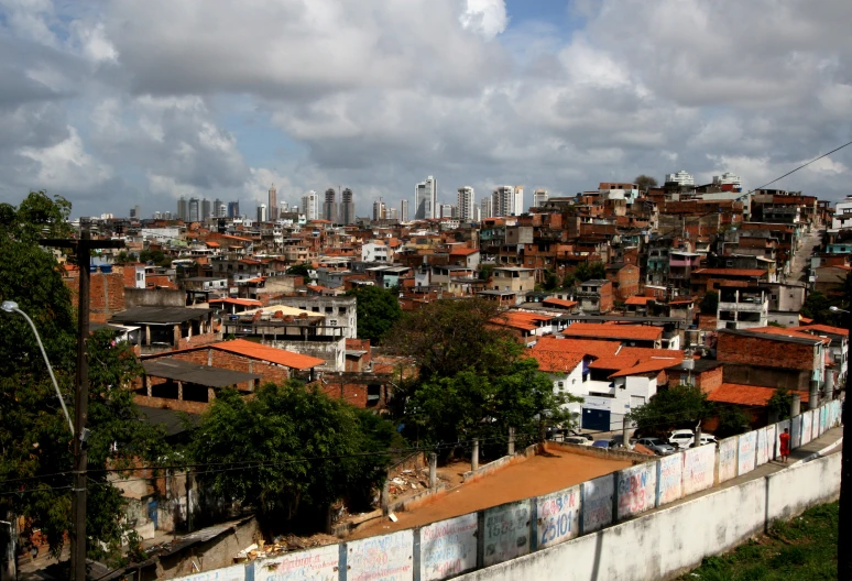 a large city next to a street with many buildings on it