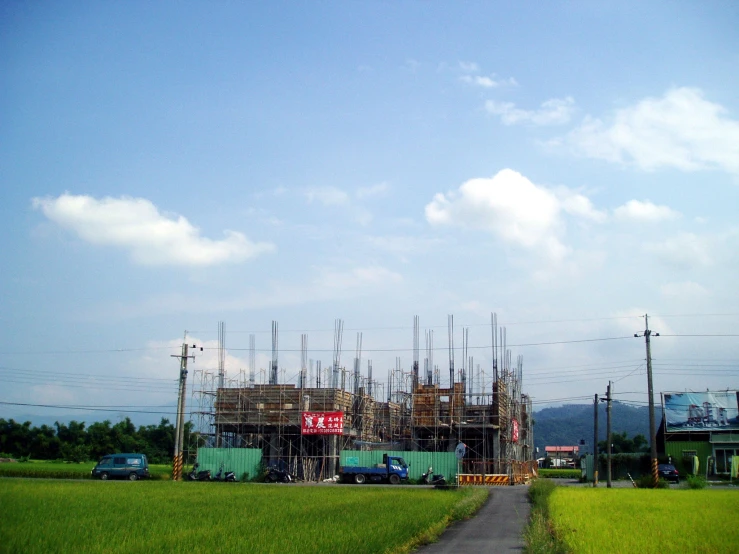 an oil well under construction near a rural road