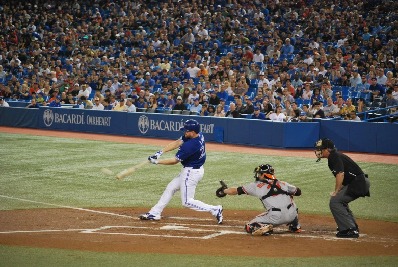 a baseball player swinging at the ball during a game