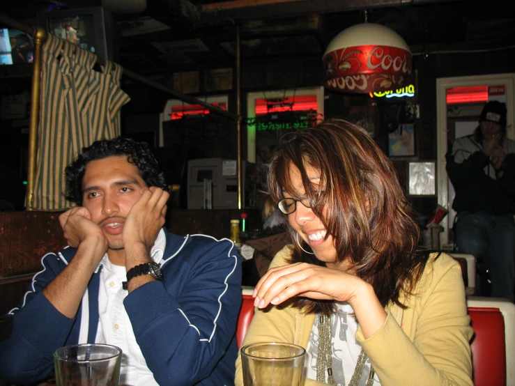 a woman and a man sitting at a table