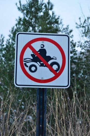 a road sign prohibiting motorcycles allowed in the area