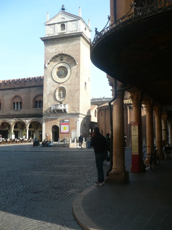 an old building with a clock tower in front of it