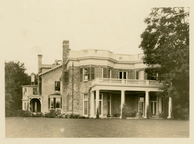 an old house with a large front porch