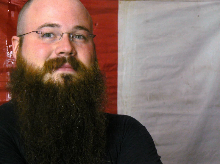 a man with a long beard and glasses