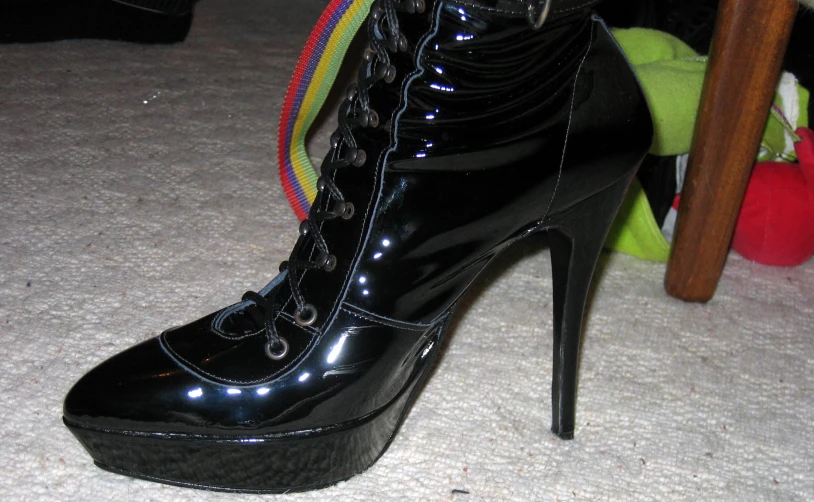 black platform shoes with colorful laces on top