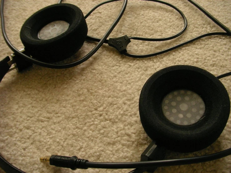 some headphones that are laying on the ground