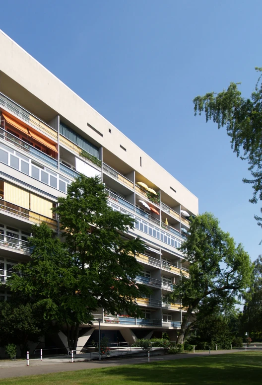 large multilevle building with balconies on the second floor