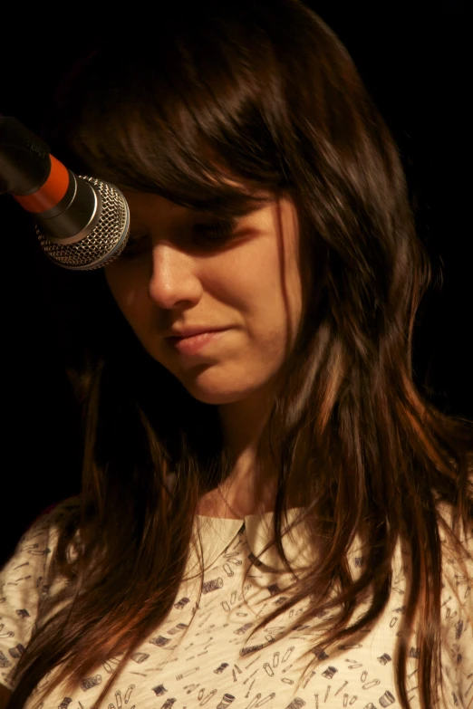 a woman with a microphone on top of her head