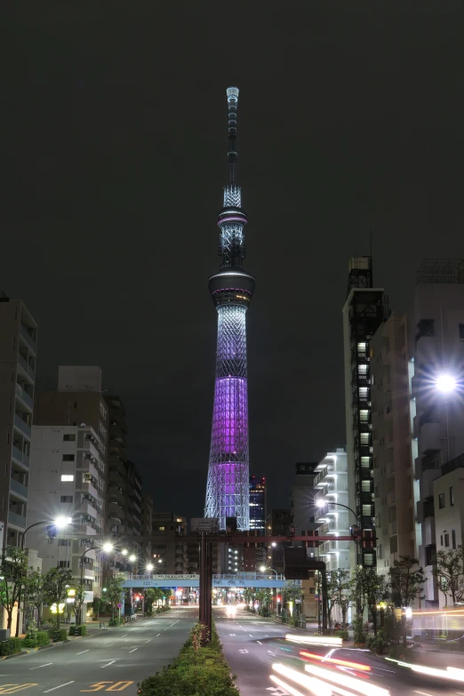 a tall, ornate clock tower in the middle of an urban city