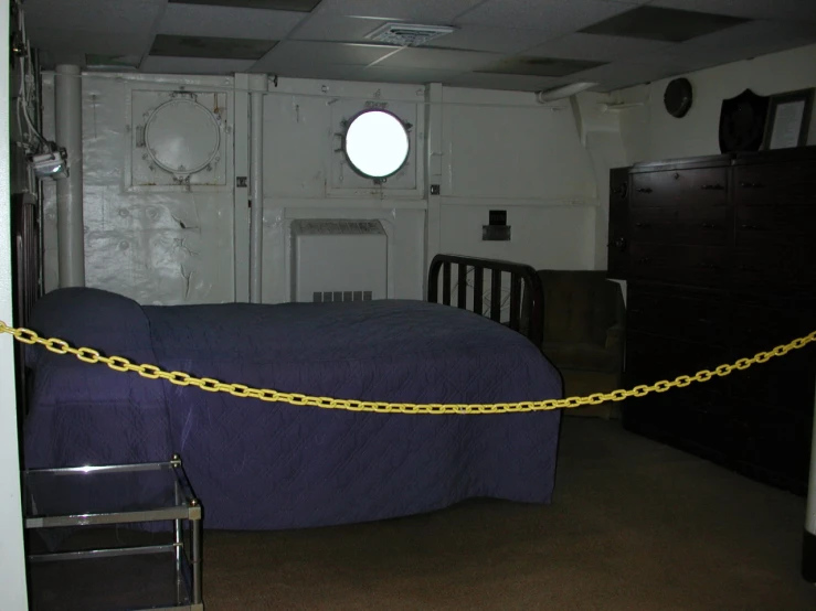 a yellow rope is attached to the ceiling of a bedroom