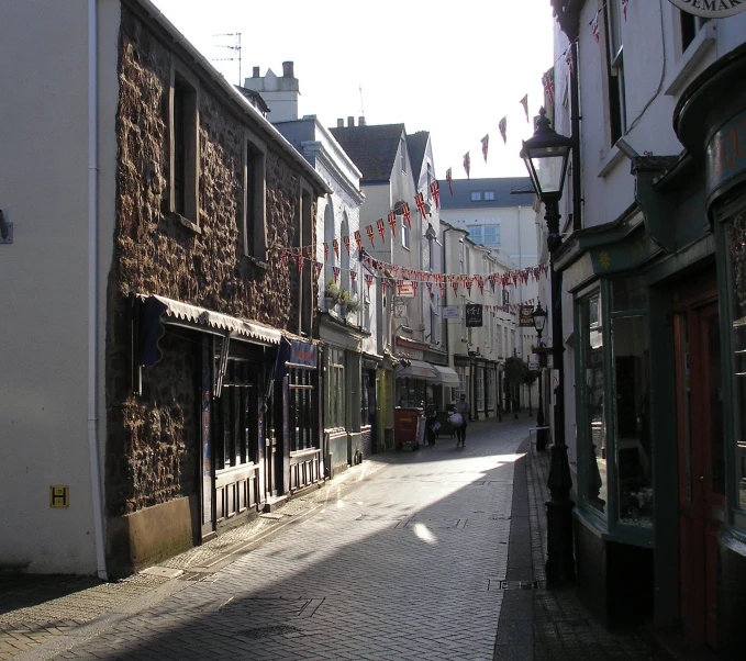 there is a small town street that has a clock tower