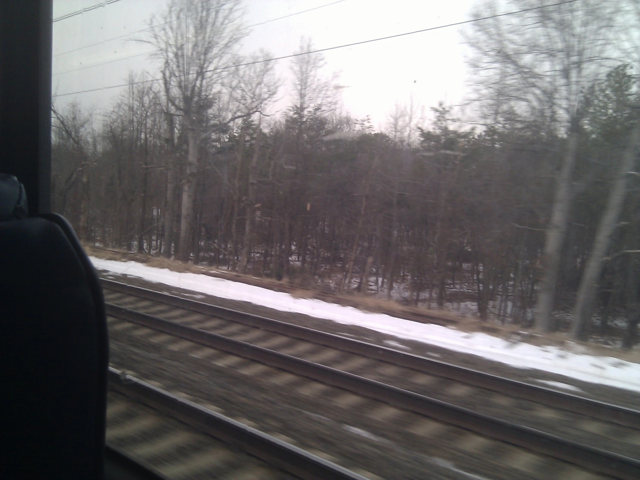 the view from the window of the railroad tracks in winter