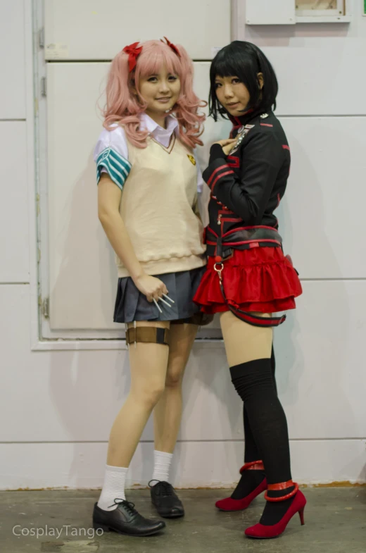 two cosplayed characters standing side by side