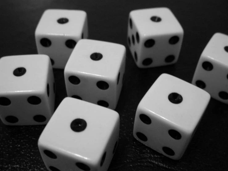 six dice in white color sitting on top of each other