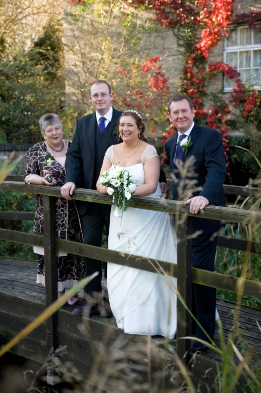 an image of people on a bridge getting ready to wed