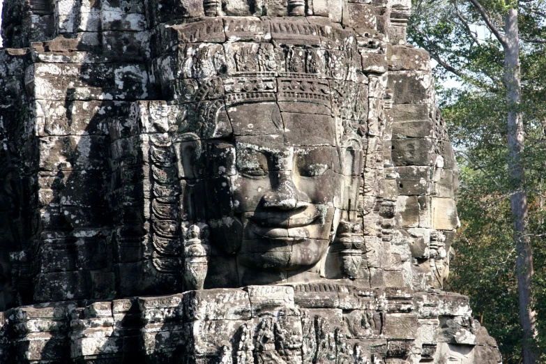 a carving of a head is pictured at a temple