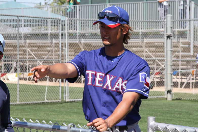 a close up of a baseball player wearing a uniform